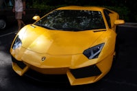 a yellow lamborghini parked in a parking lot